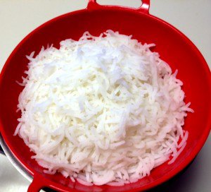 Drain cooked rice in colander